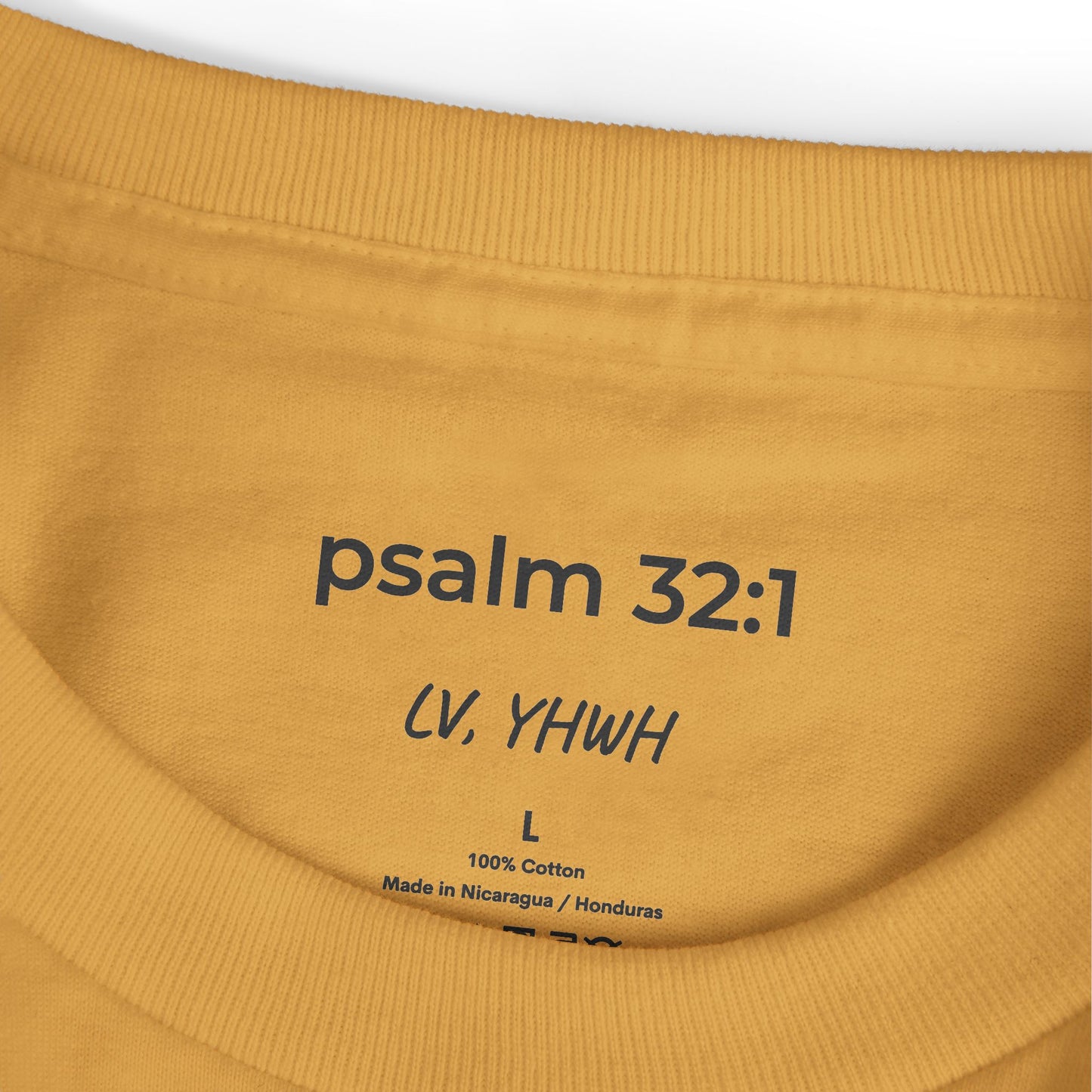 Printify mustard t shirt close up of printed neck label reading psalm 32 1 and 100 percent cotton Christian graphic t-shirt