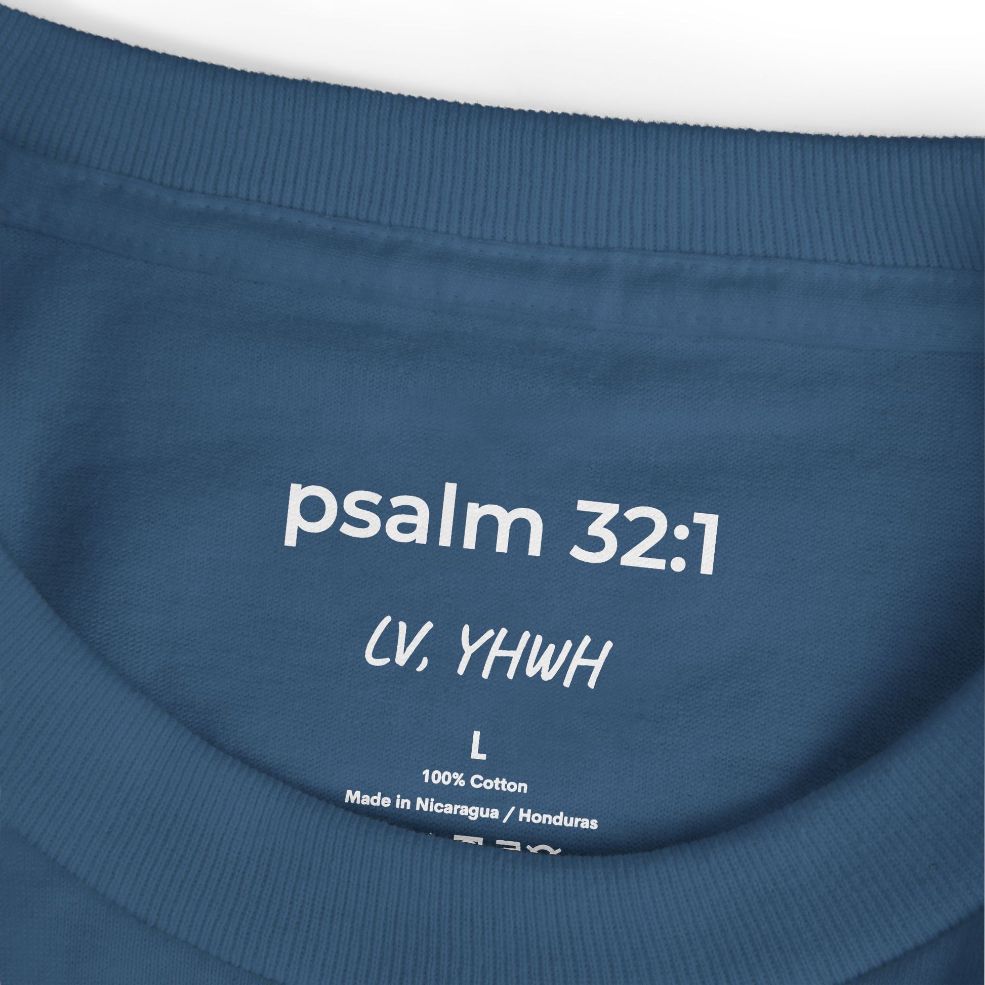 Blue cotton Printify T-shirt inner neck print reading psalm 32:1 with size L and manufacturing tag Christian graphic t-shirt